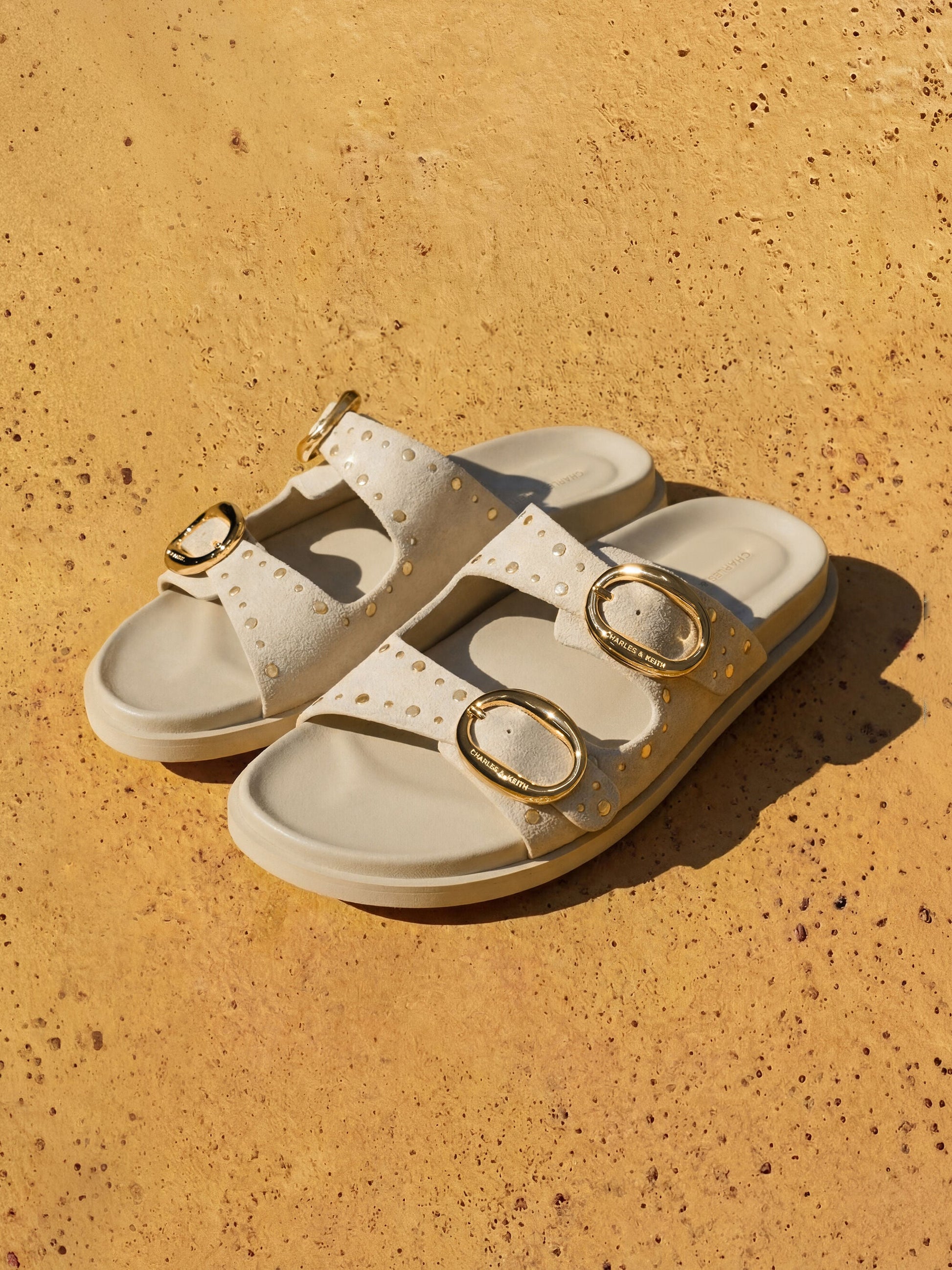 Studded Buckled Double-Strap Slides - Beige | CHARLES & KEITH