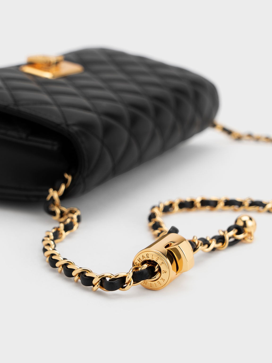 Cressida Quilted Push-Lock Clutch - Black | CHARLES & KEITH