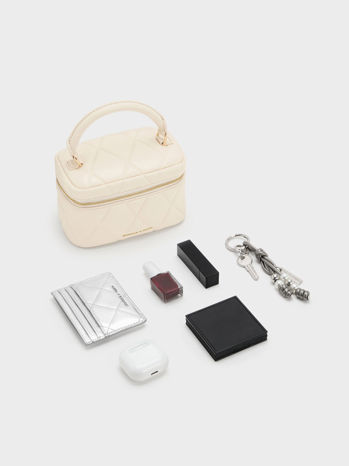 Arwen Quilted Top Handle Vanity Bag - Cream | CHARLES & KEITH
