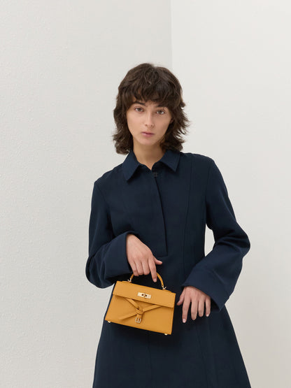 Tricha Knotted-Belt Top Handle Bag - Saffron Yellow | CHARLES & KEITH