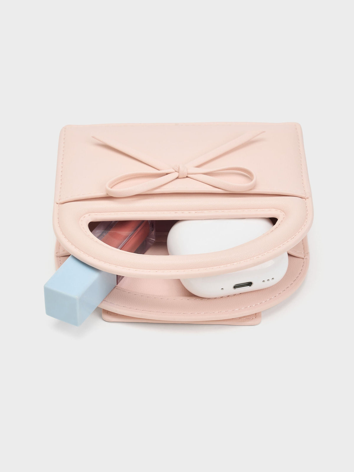 Reese Bow Top Handle Wristlet - Soft Pink | CHARLES & KEITH