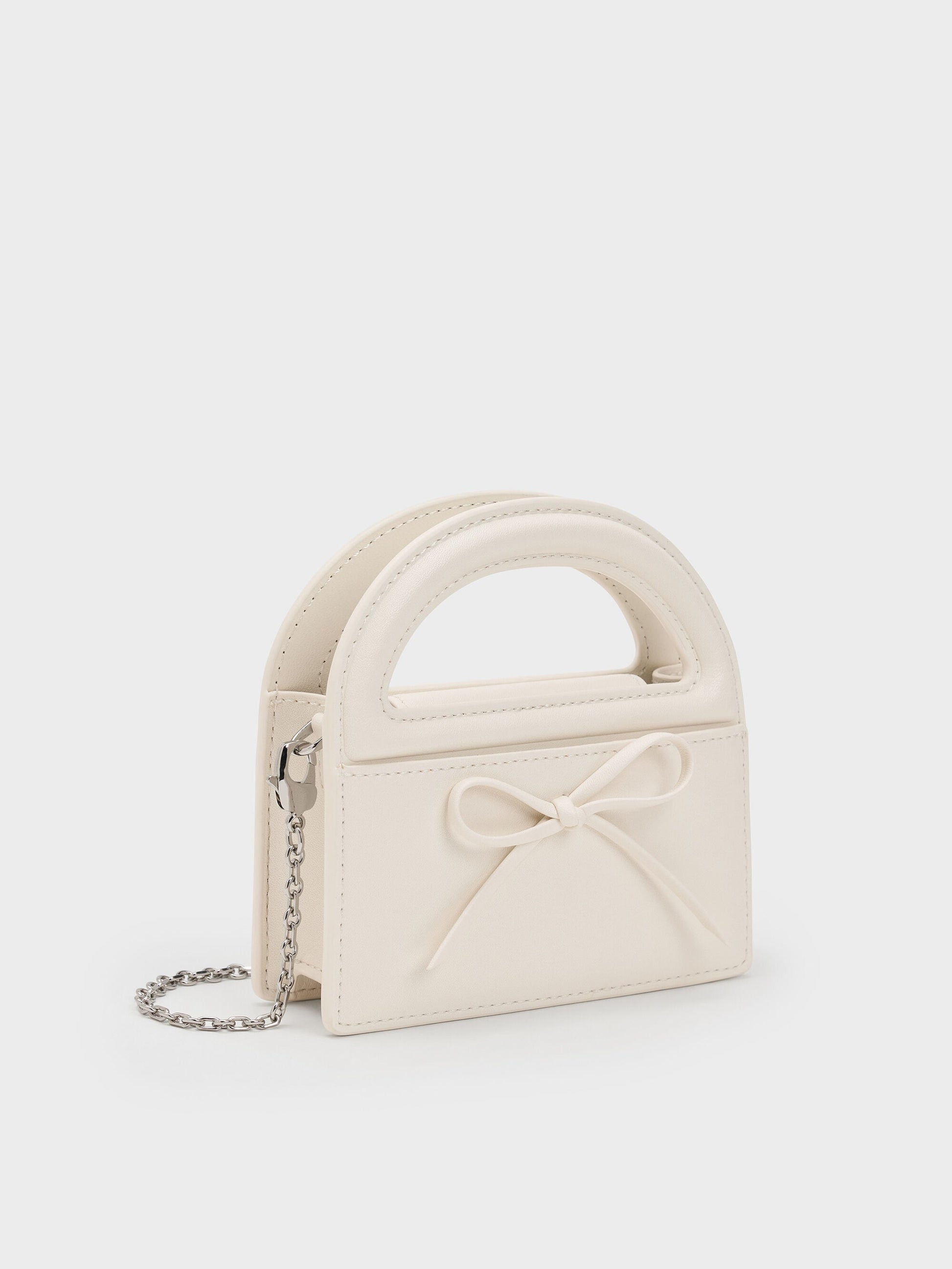 Reese Bow Top Handle Wristlet - Cream | CHARLES & KEITH