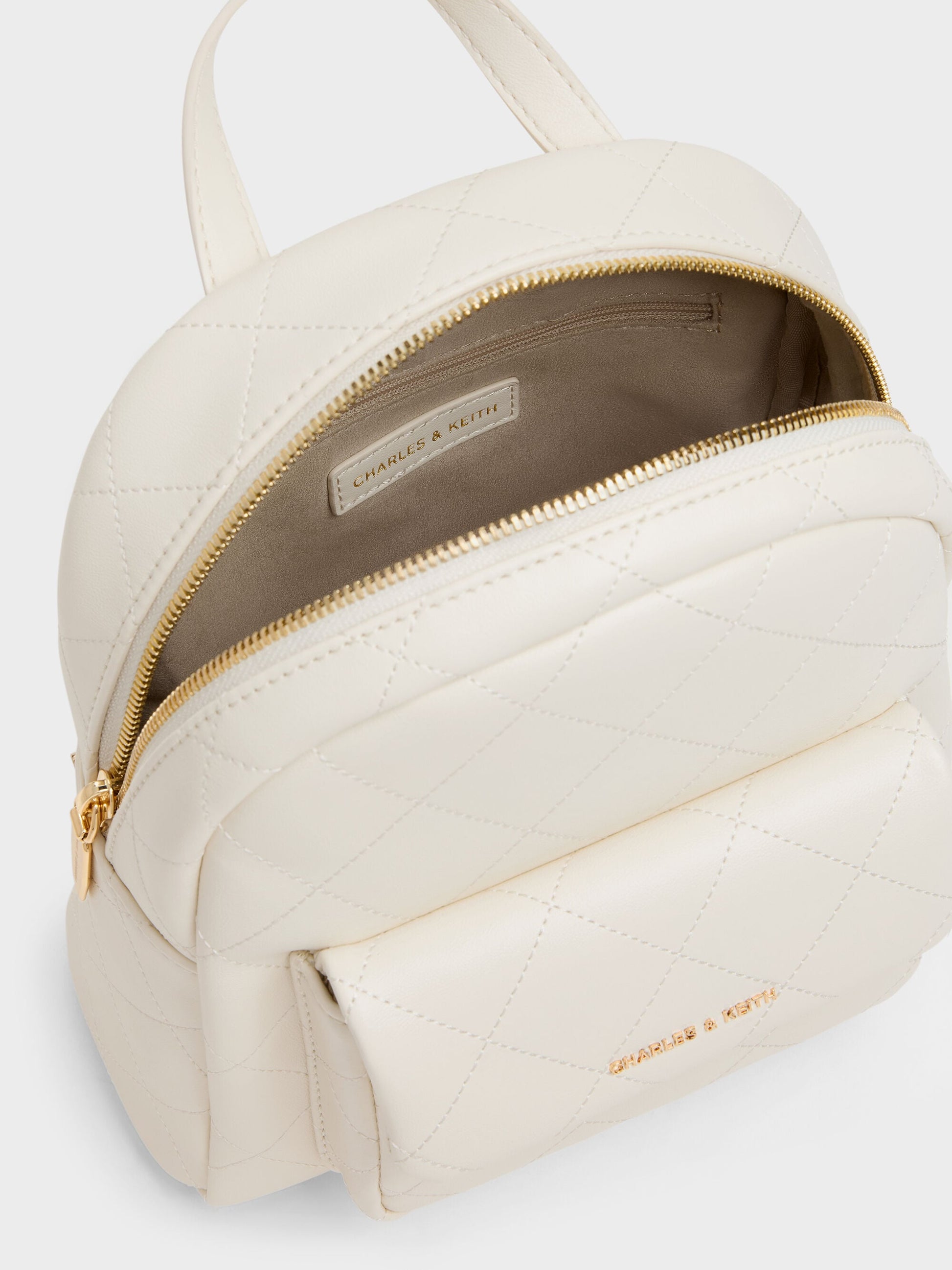 Alva Quilted Front-Pocket Backpack - Cream | CHARLES & KEITH