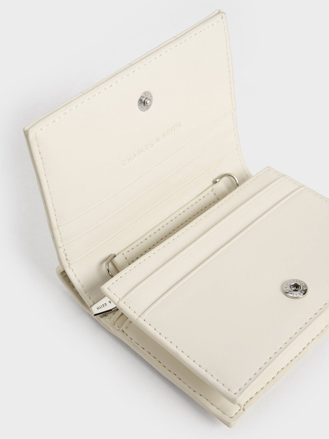 Cassia Quilted Wallet On Chain - Cream | CHARLES & KEITH