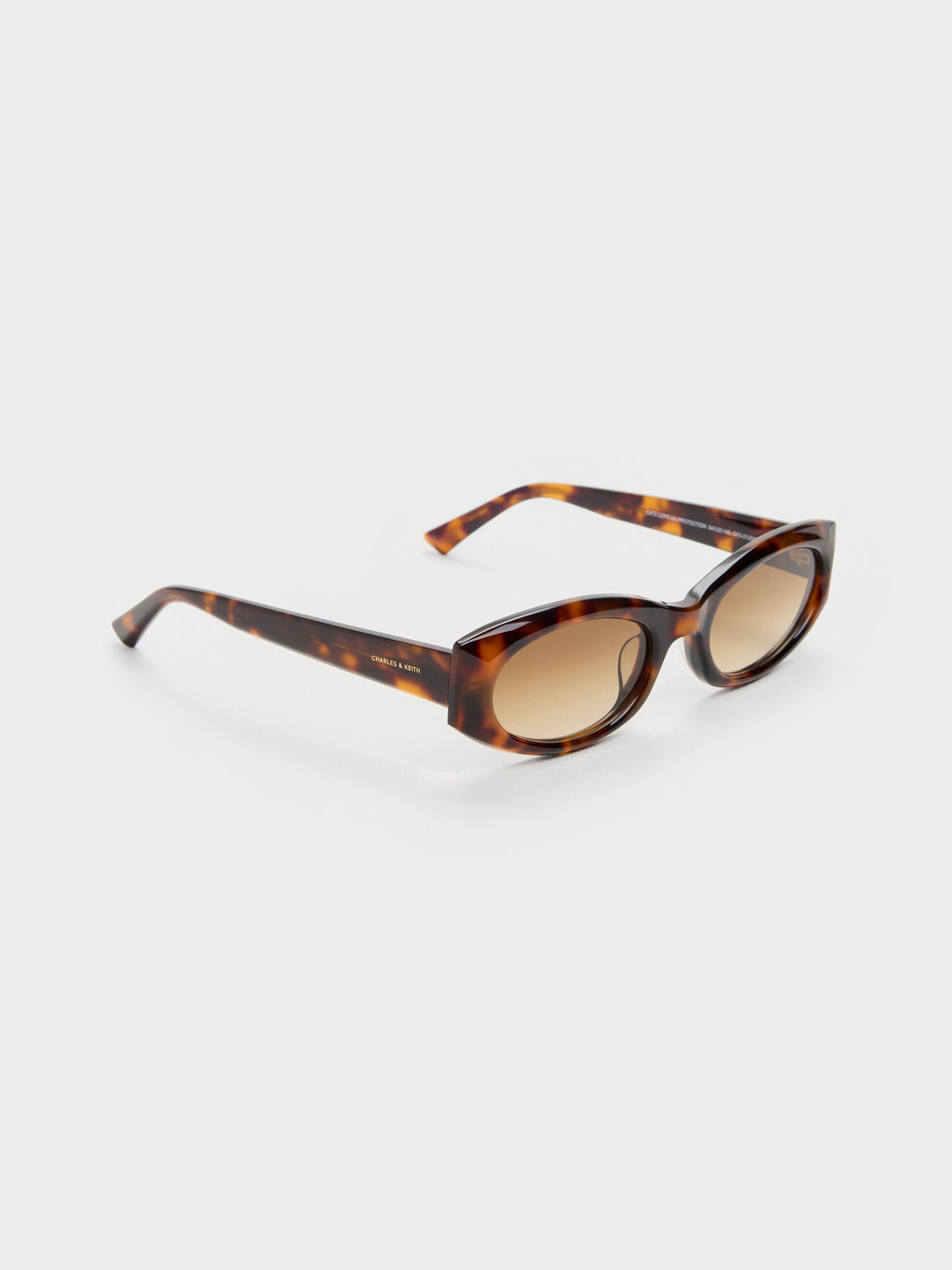 Aubrey Oval Sunglasses - T. Shell | CHARLES & KEITH