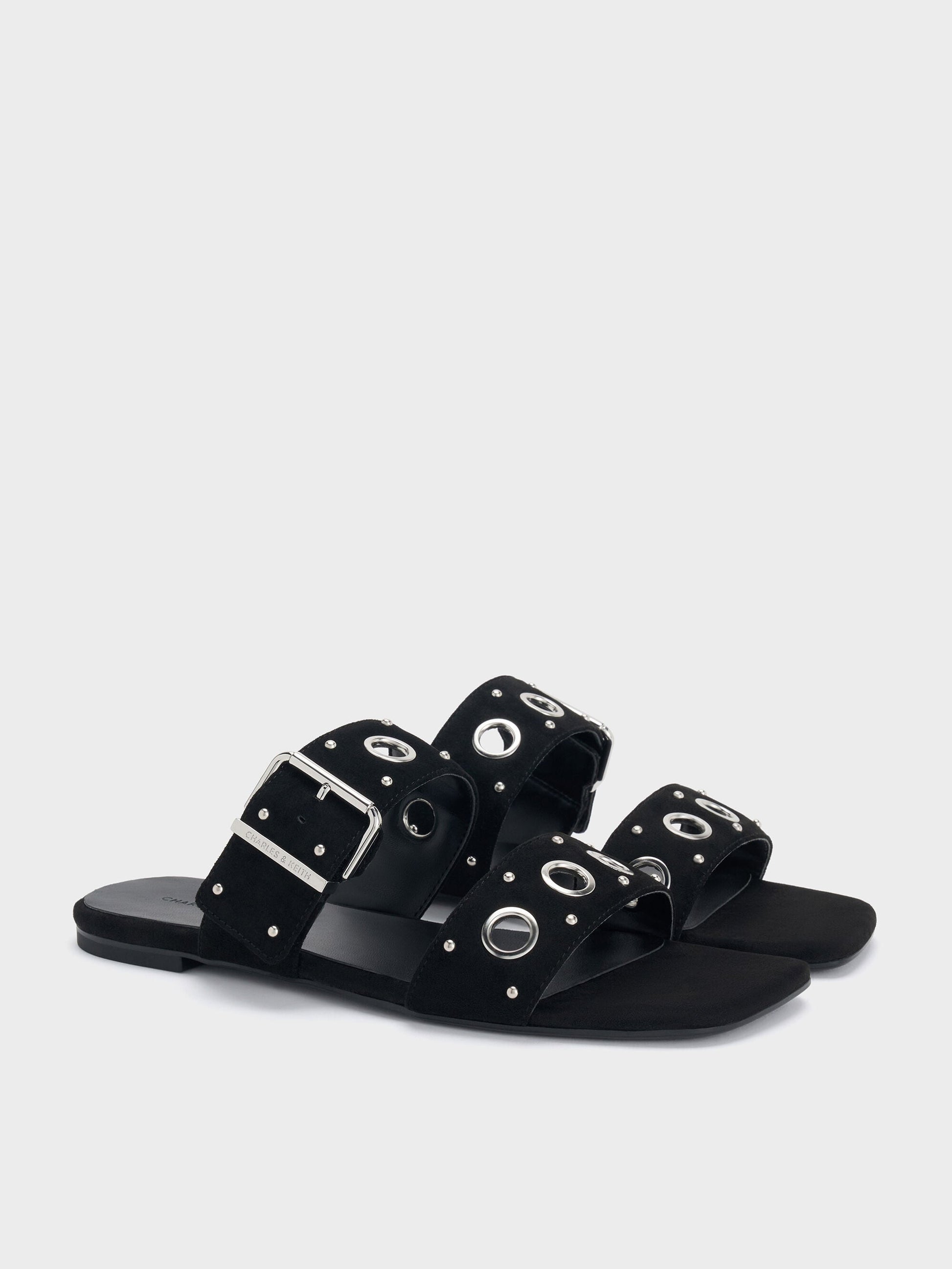 Faux Suede Grommet Buckled Slides - Black Textured | CHARLES & KEITH