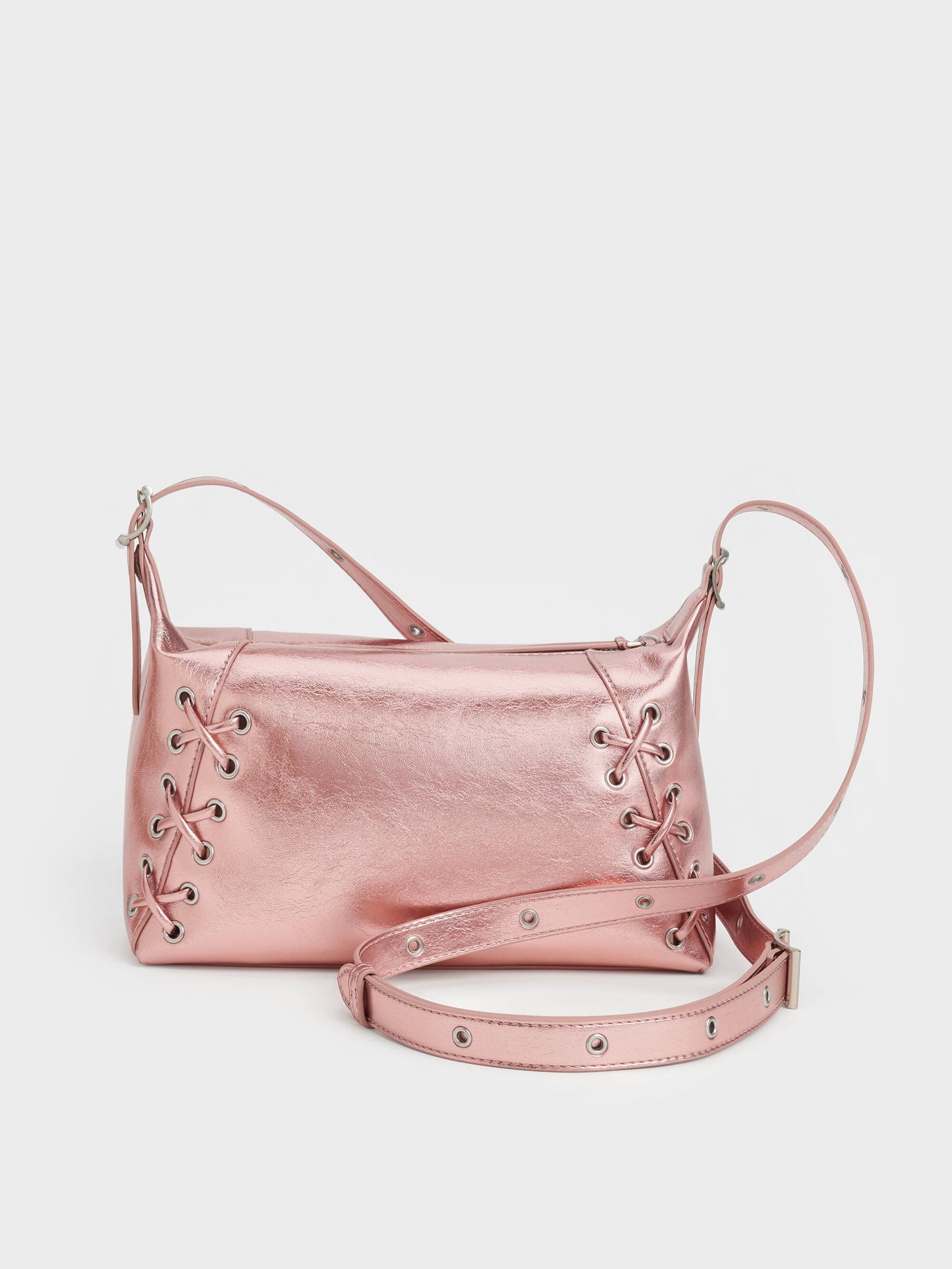 Xylia Metallic Grommet Lace-Up Shoulder Bag - Aura Pink | CHARLES & KEITH